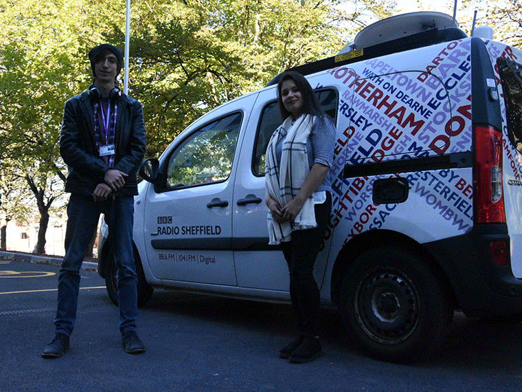 Lavin and Josh stood next to the BBC Radio Sheffield van