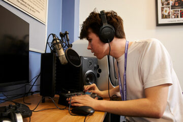 A student using media equipment