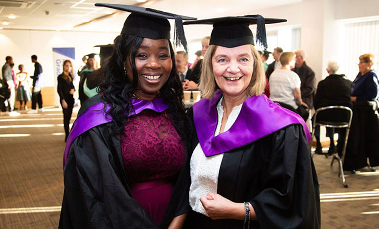 Two ladies at their graduation ceremony