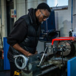 An engineering student working in the workshop