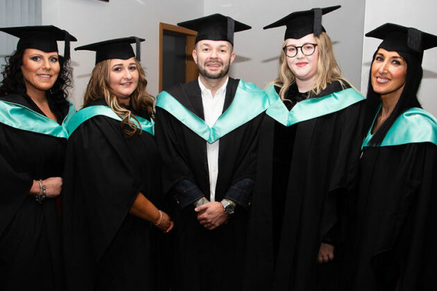 Graduates from the 2023 ceremony posing for a photo