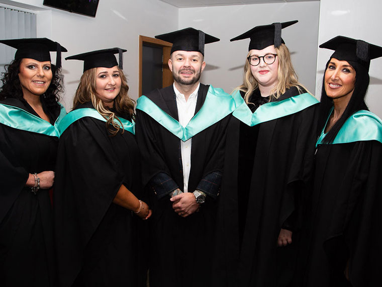 Graduates from the 2023 ceremony posing for a photo