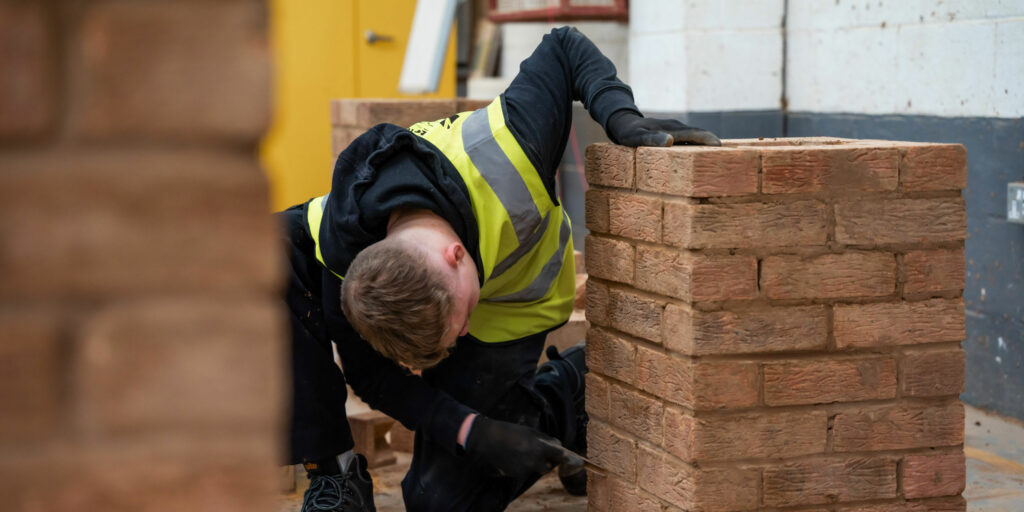 A student bricklaying