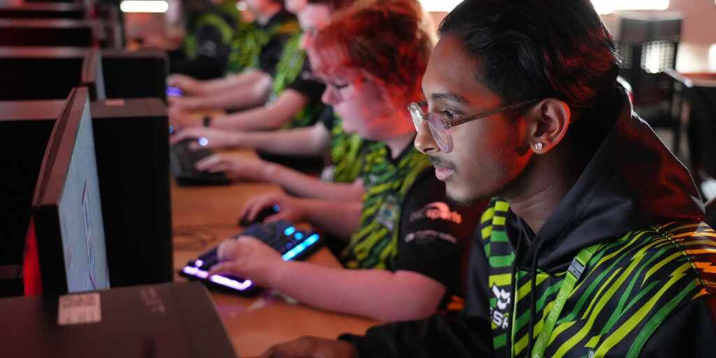 Esports students sat at computers, gaming