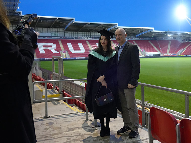 Graduation photos being taken pitch side