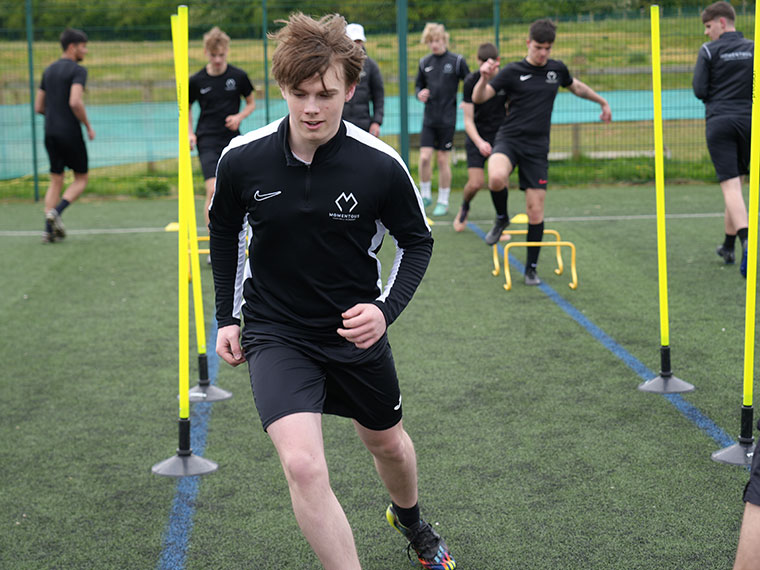 Momentous Football Academy students training outdoors
