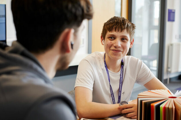 Two students sat at a table
