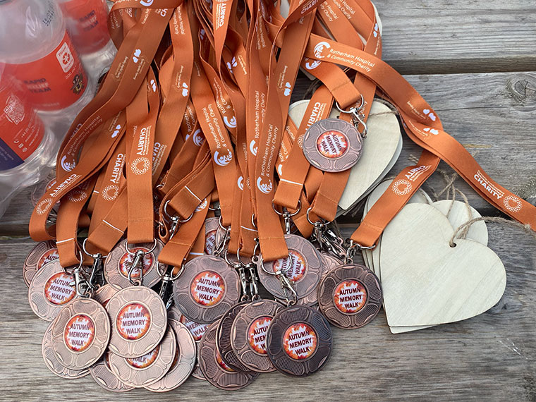 Medals for the walkers of the NHS Autumn Memory Walk 2025