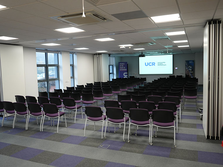 Lots of chairs laid out in lines in the UCR's seminar room