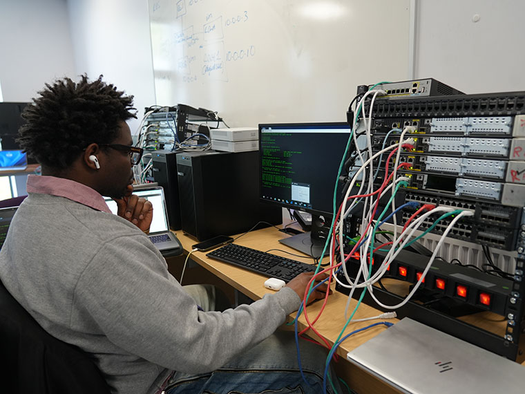 Student sat in front of a computer