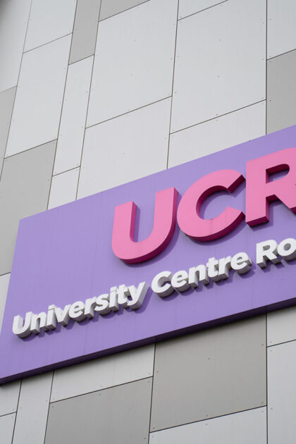 Signage on the outside wall of the UCR building