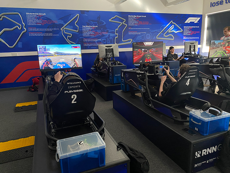 Students using the F1 Simulators in the Esports department